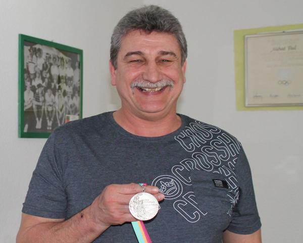 Michael Paul actions of his Olympic silver medal.