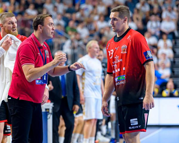 Patrik Ligetvari - here talking to coach Momir Ilic - and Telekom Veszprem face their first competitive match.